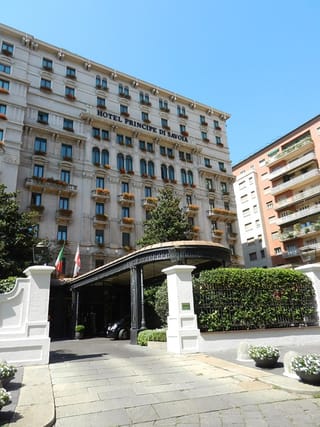 The neoclassical facade of the Hotel Principe di Savoia in Milan
