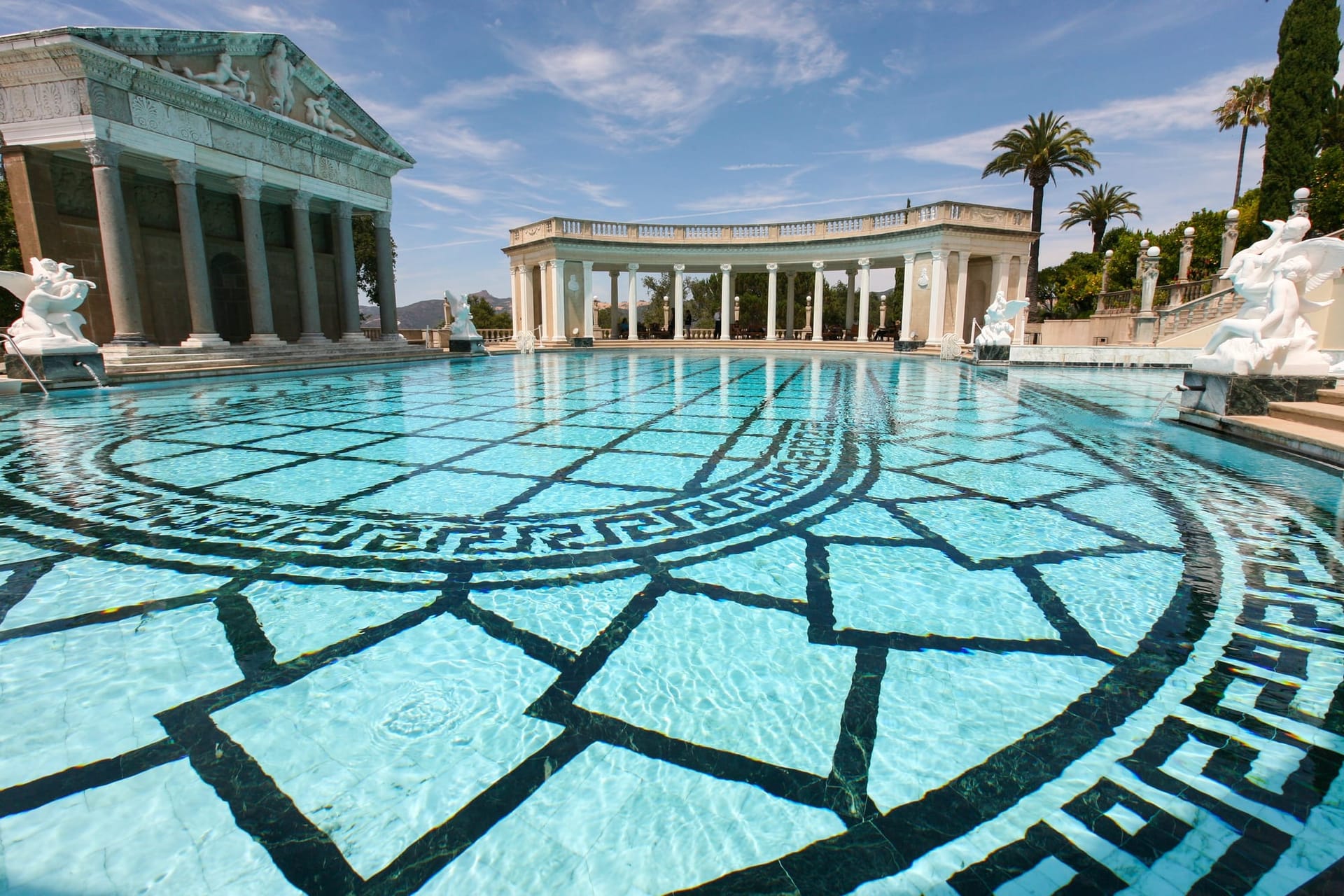 The Neptune Pool at Hearst Castle, framed by its Roman temple facade and marble colonnades