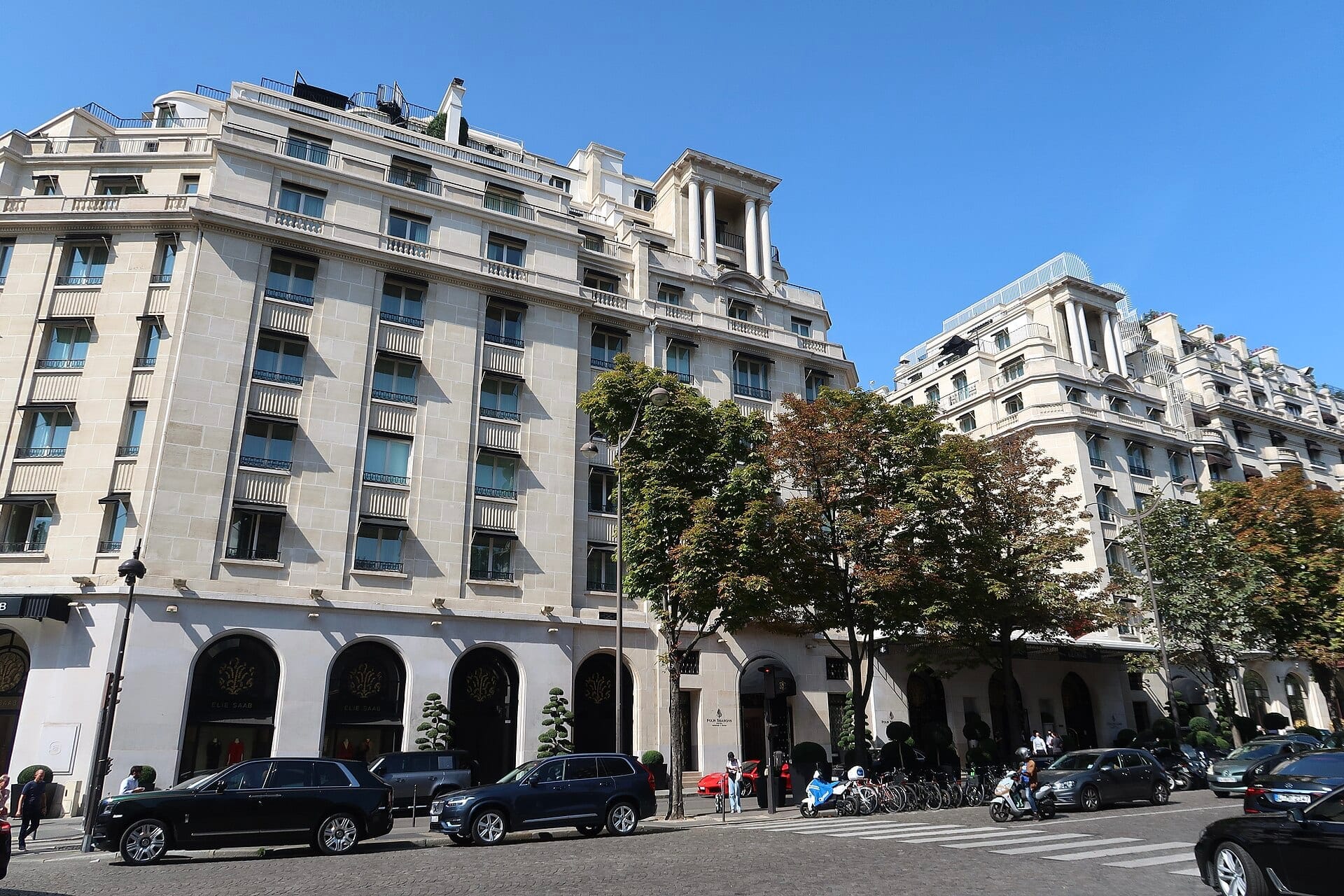 The limestone facade of the Four Seasons Hotel George V on Avenue George V in Paris