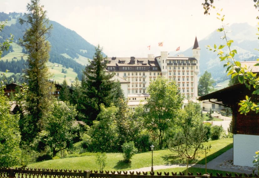 The turreted Gstaad Palace hotel overlooking the village in the Swiss Alps