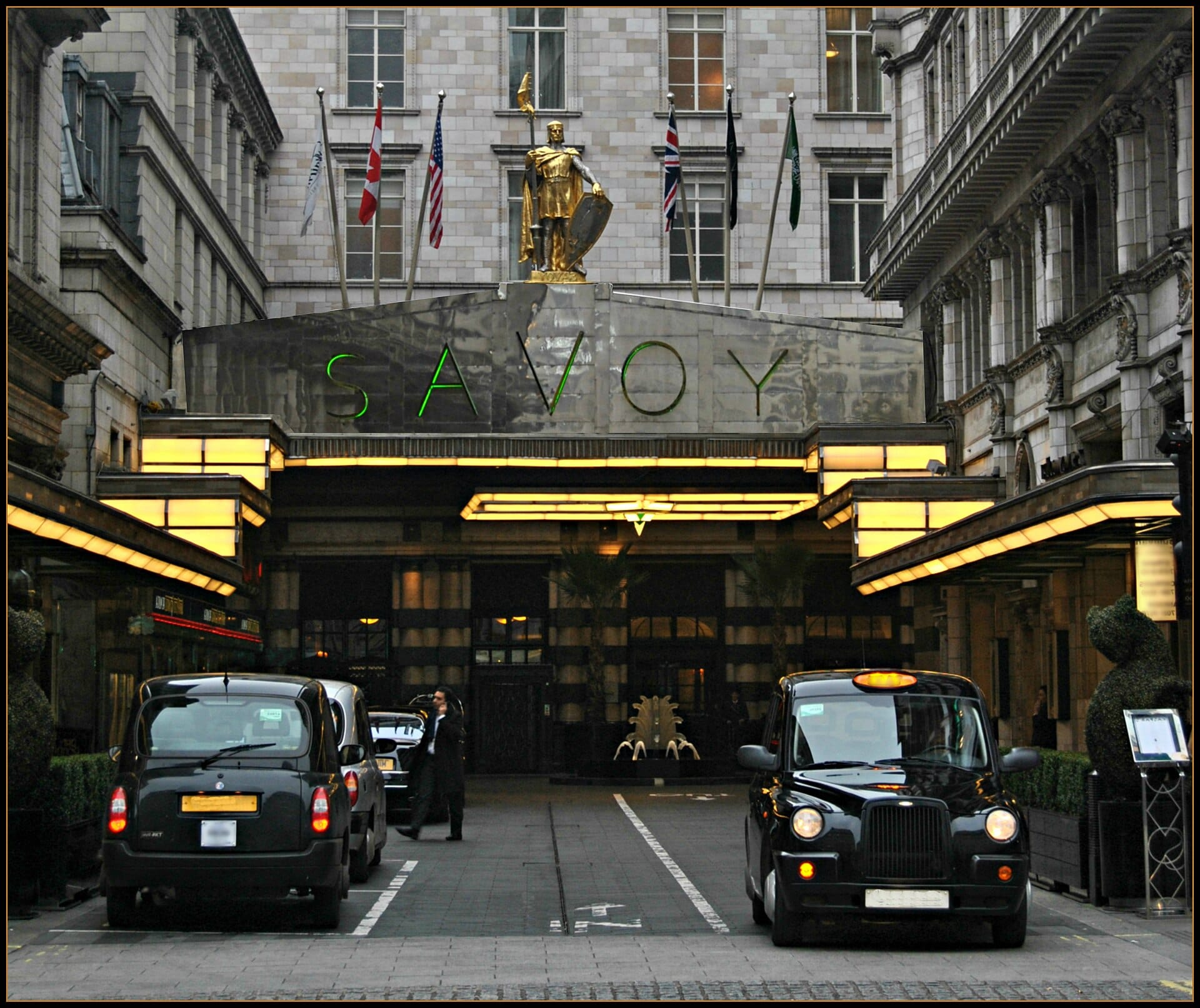 The Art Deco entrance and forecourt of The Savoy on the Strand in London