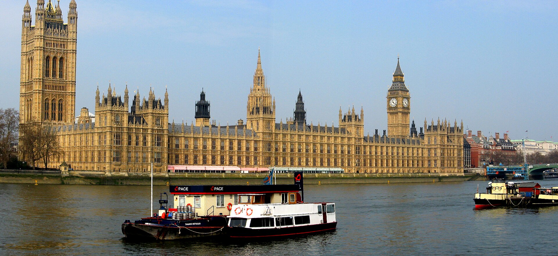 The Westminster skyline along the River Thames, with the Houses of Parliament and the London Eye