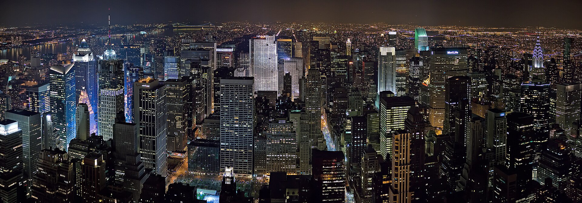 The Midtown Manhattan skyline at night, seen across the Hudson River